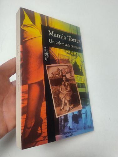 Portada del libro de UN CALOR TAN CERCANO (dedicado por la autora)